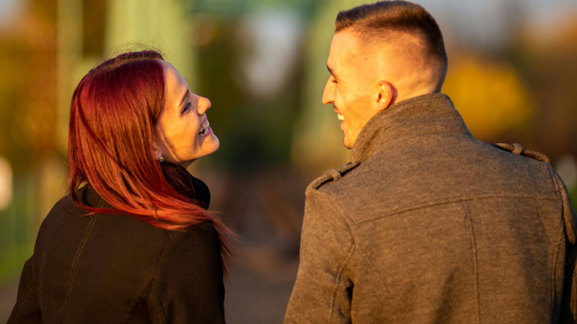man and woman standing side by side during daytime