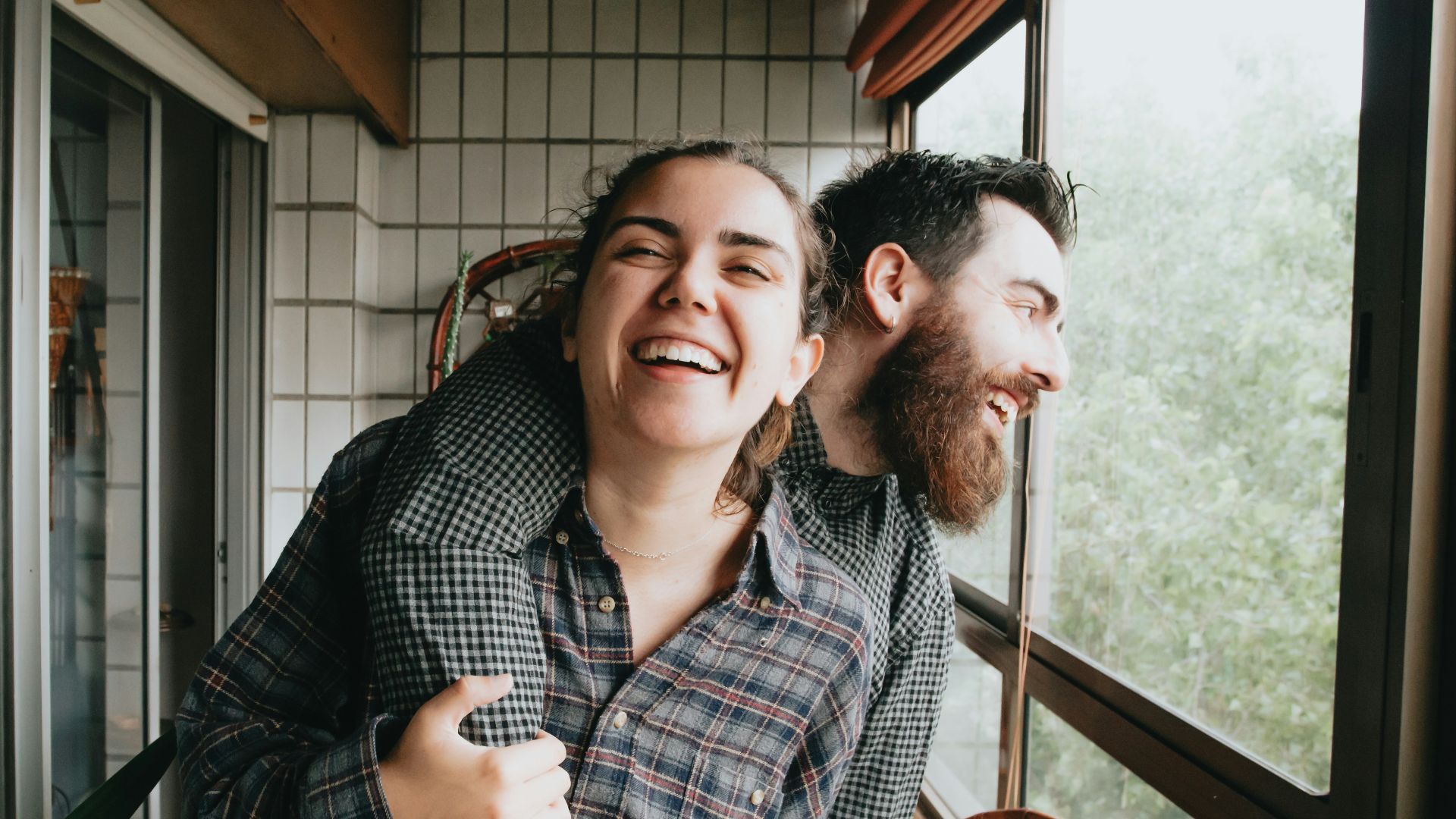man and woman sitting on chair