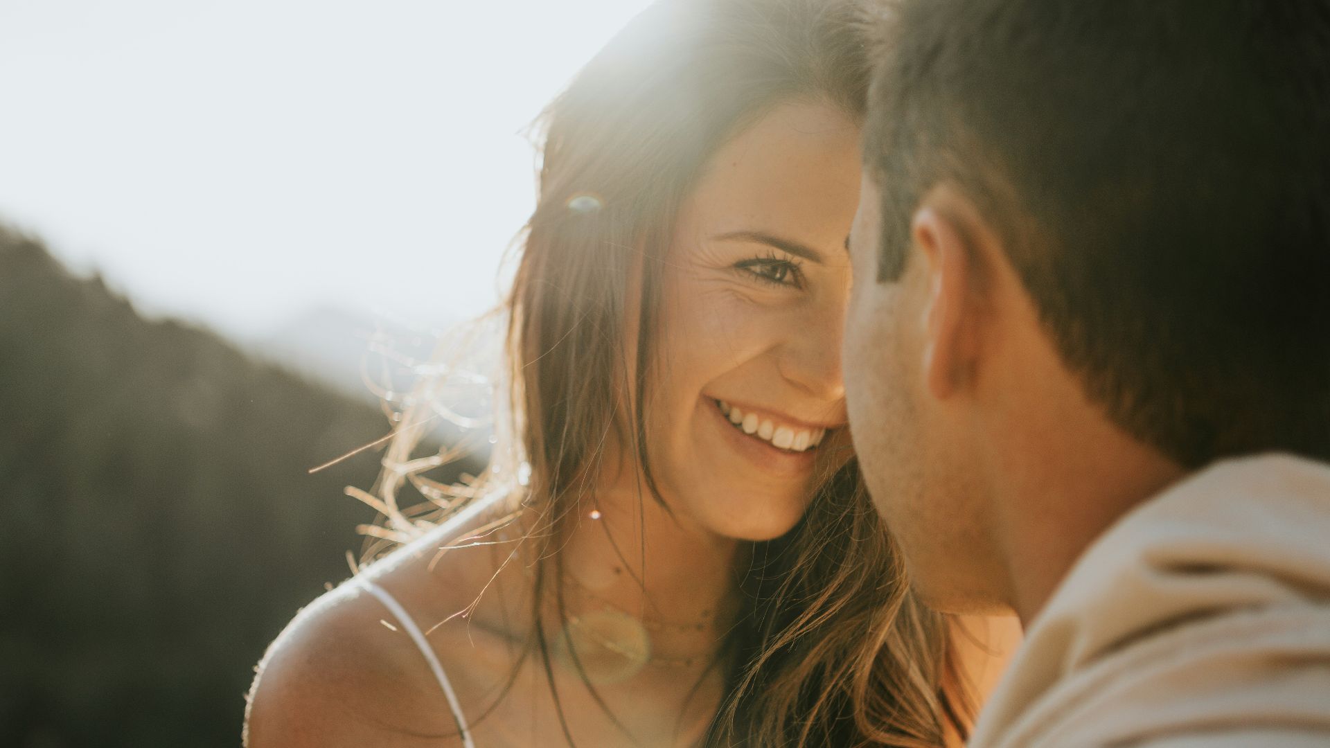 man and woman kissing during daytime