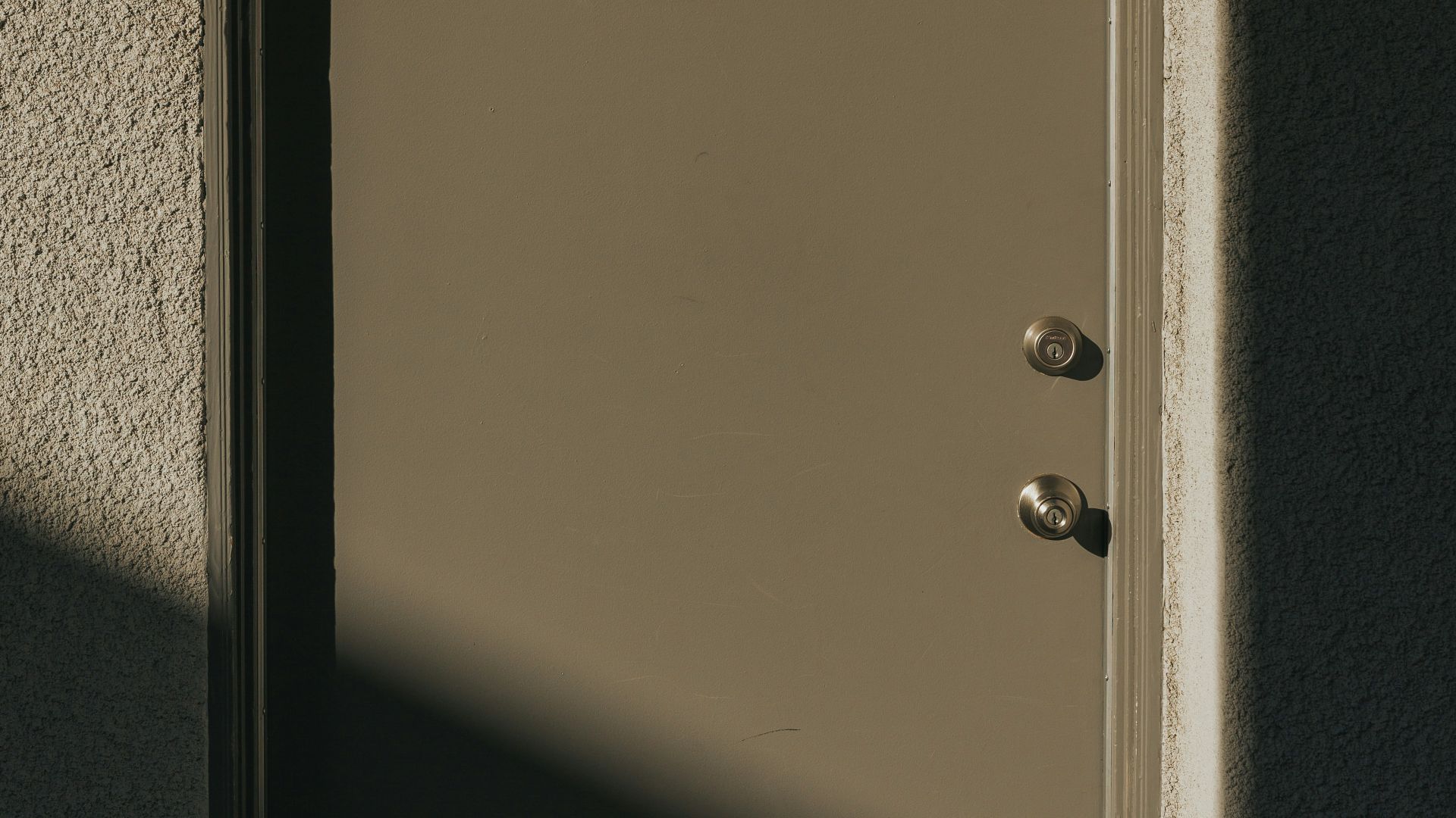 closed gray wooden door