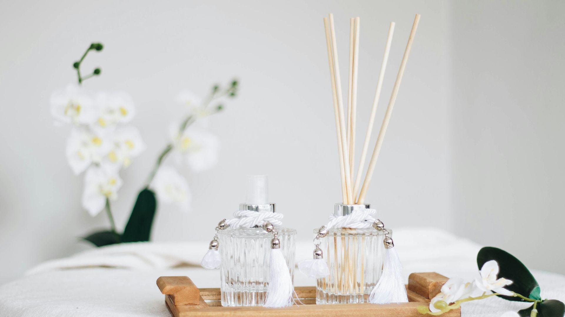 a couple of bottles sitting on top of a wooden tray