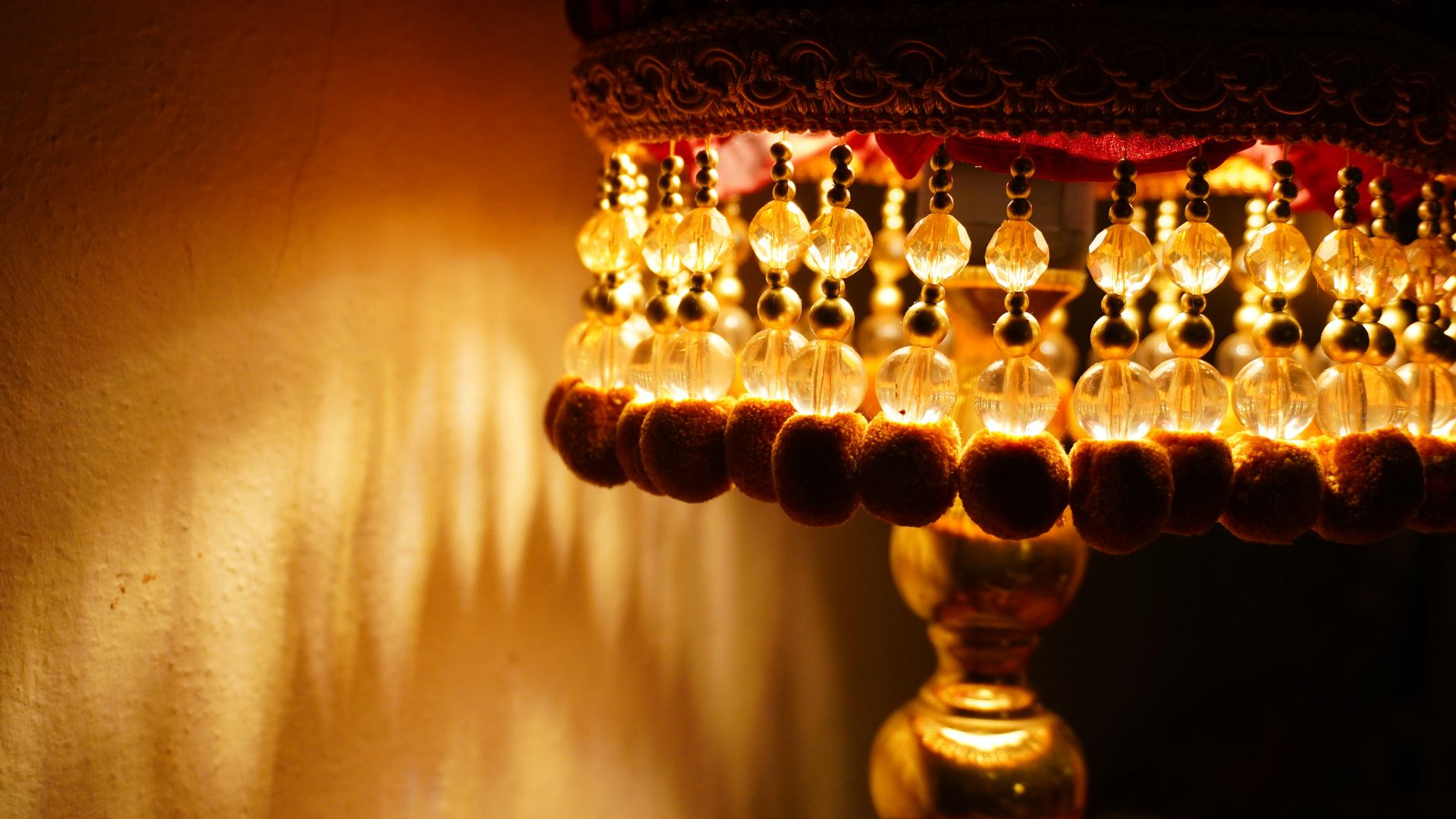 Close-up of a decorative lampshade with beaded fringe.
