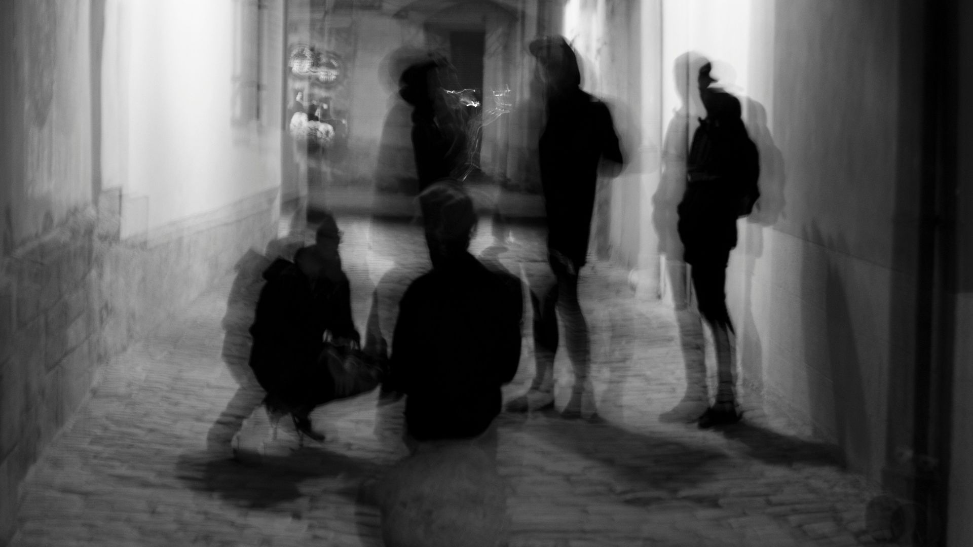 a group of people walking down a hallway