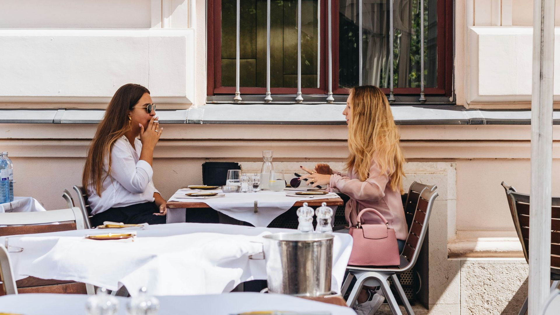 two women sitting at the table