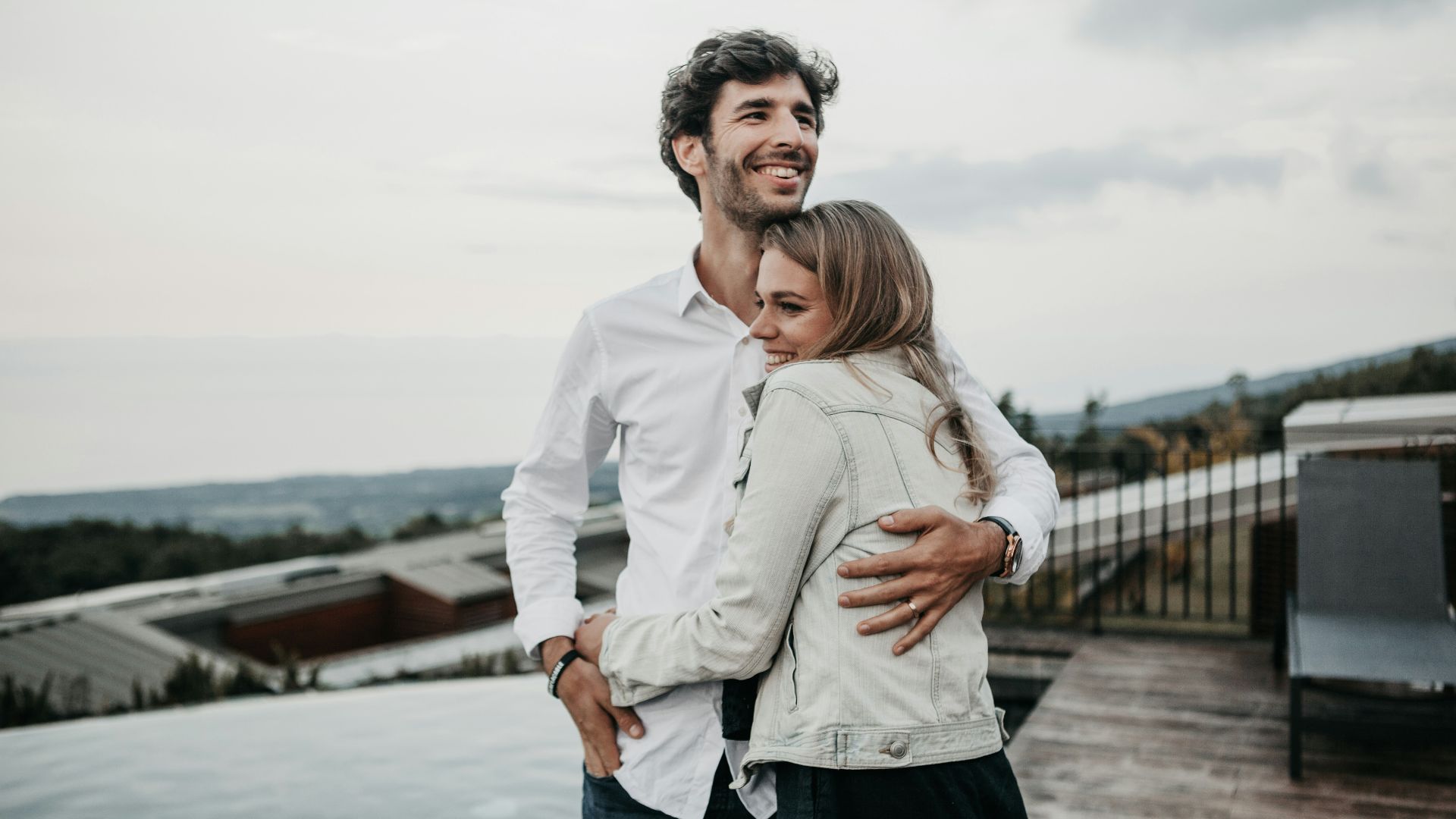 man and woman hugging each other