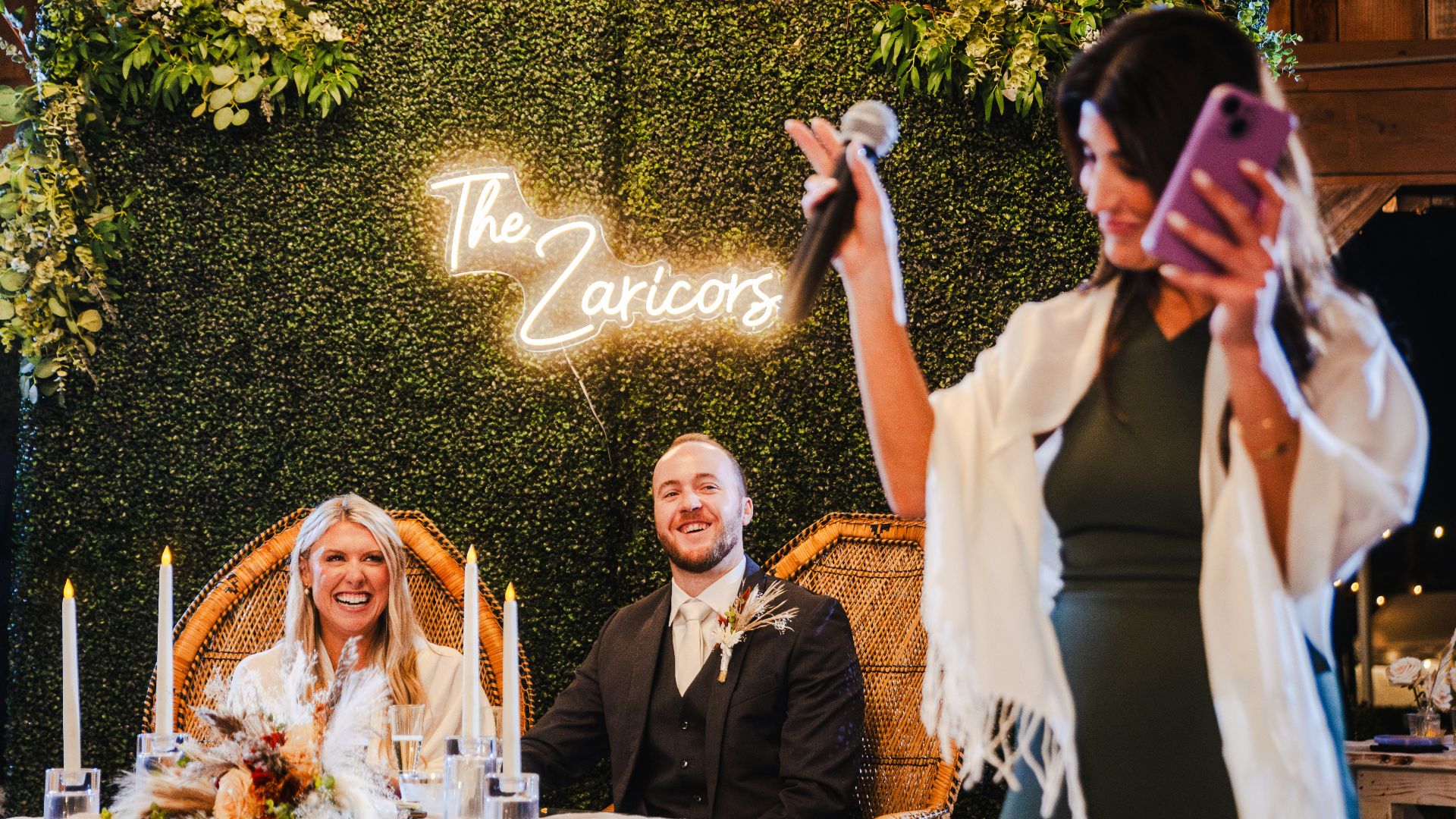 A woman taking a picture with her cell phone