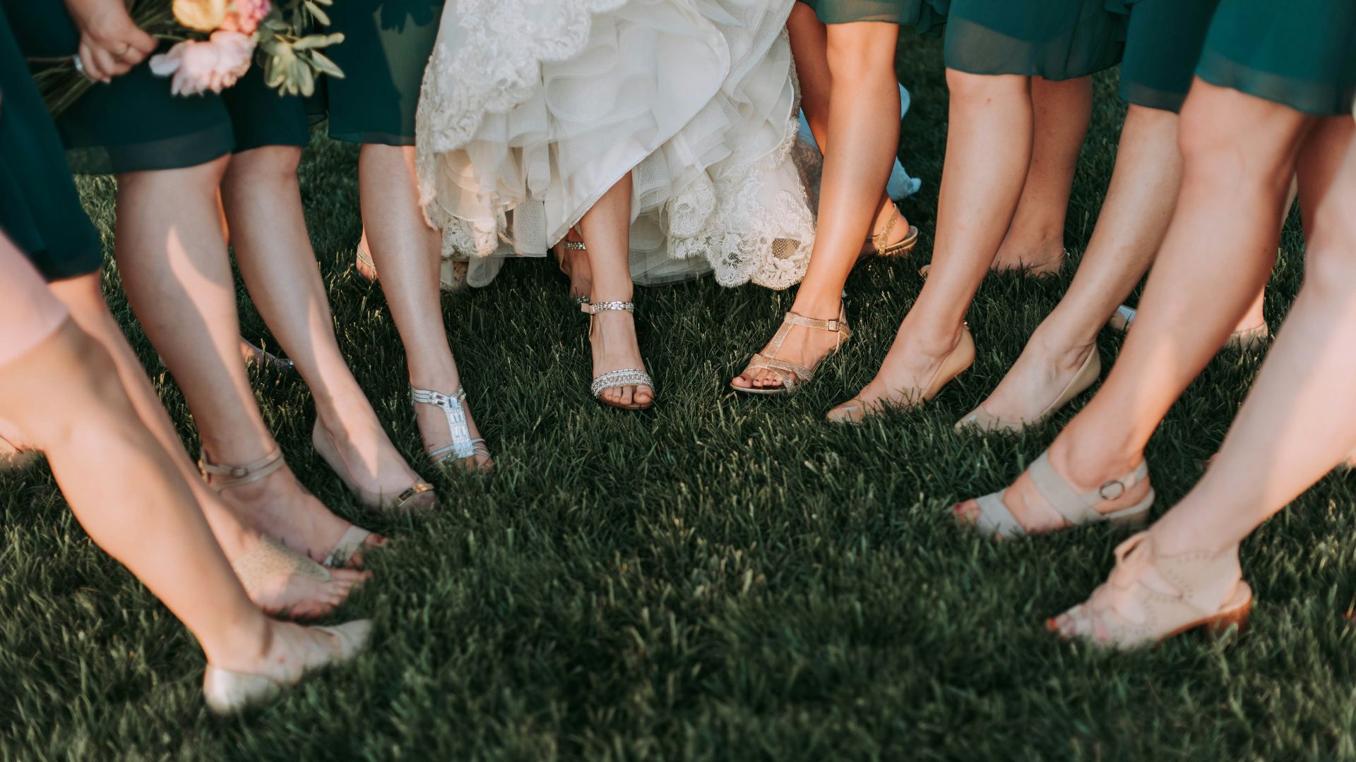 photography of womens on green grass during daytime
