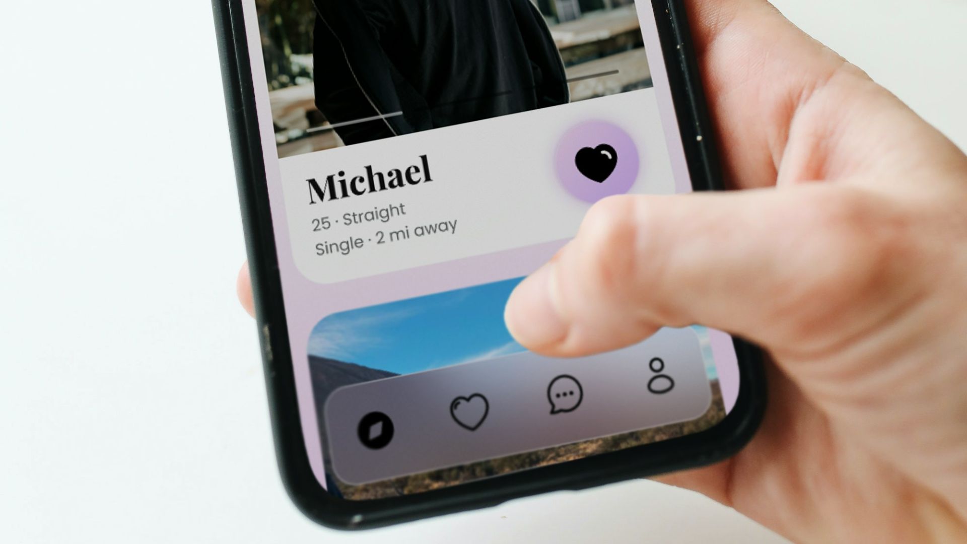 a person holding a cell phone with a picture of a man on it