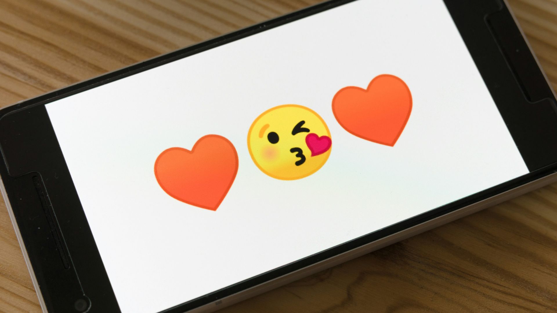 black ipad on brown wooden table