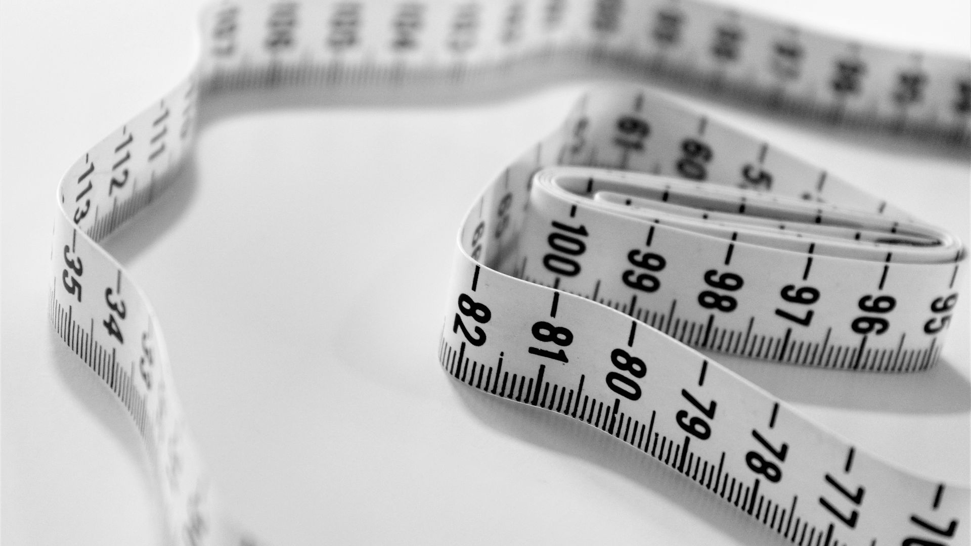selective focus photography of tape measure