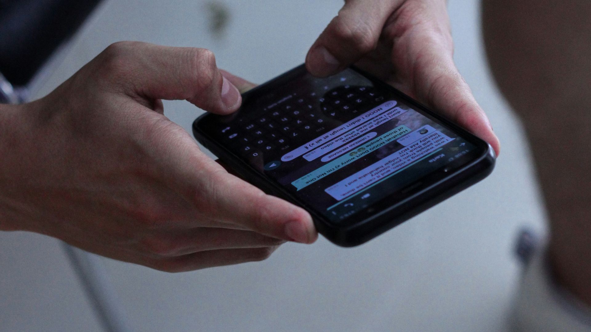 person holding black iphone 4