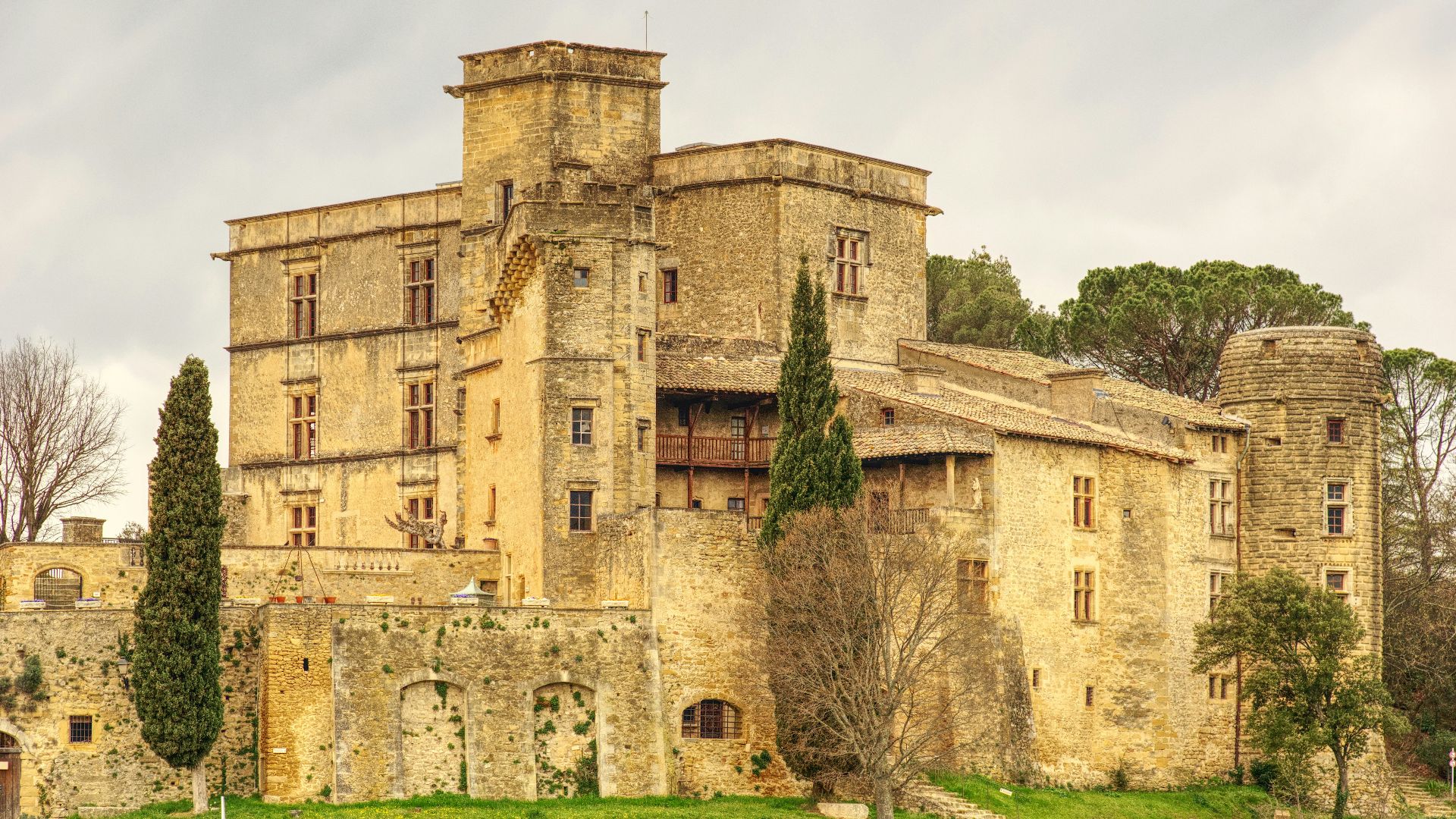 brown concrete building near green grass field during daytime