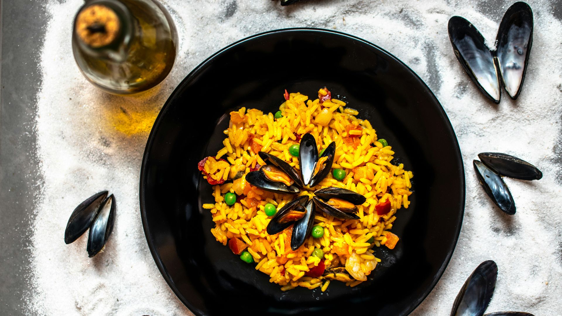 yellow flowers on black round plate