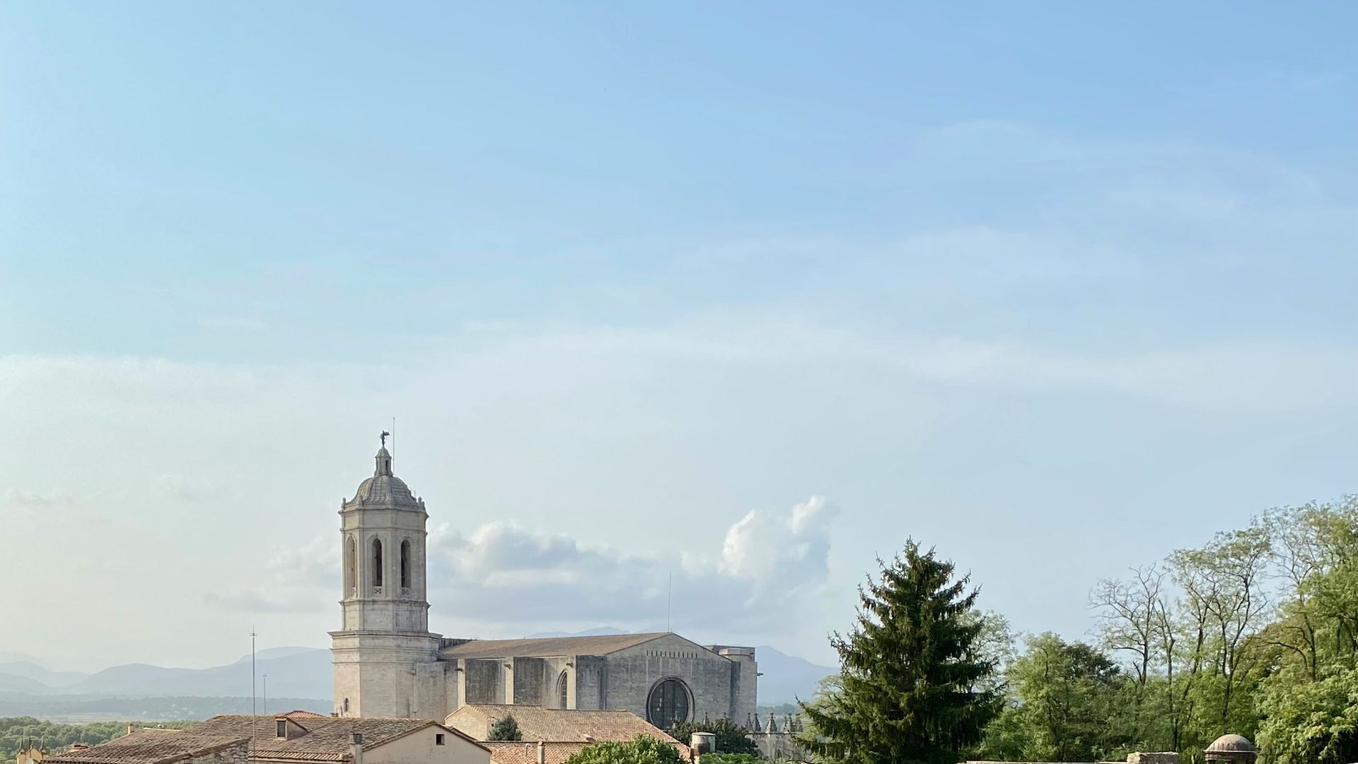 a view of a castle with a clock tower in the background
