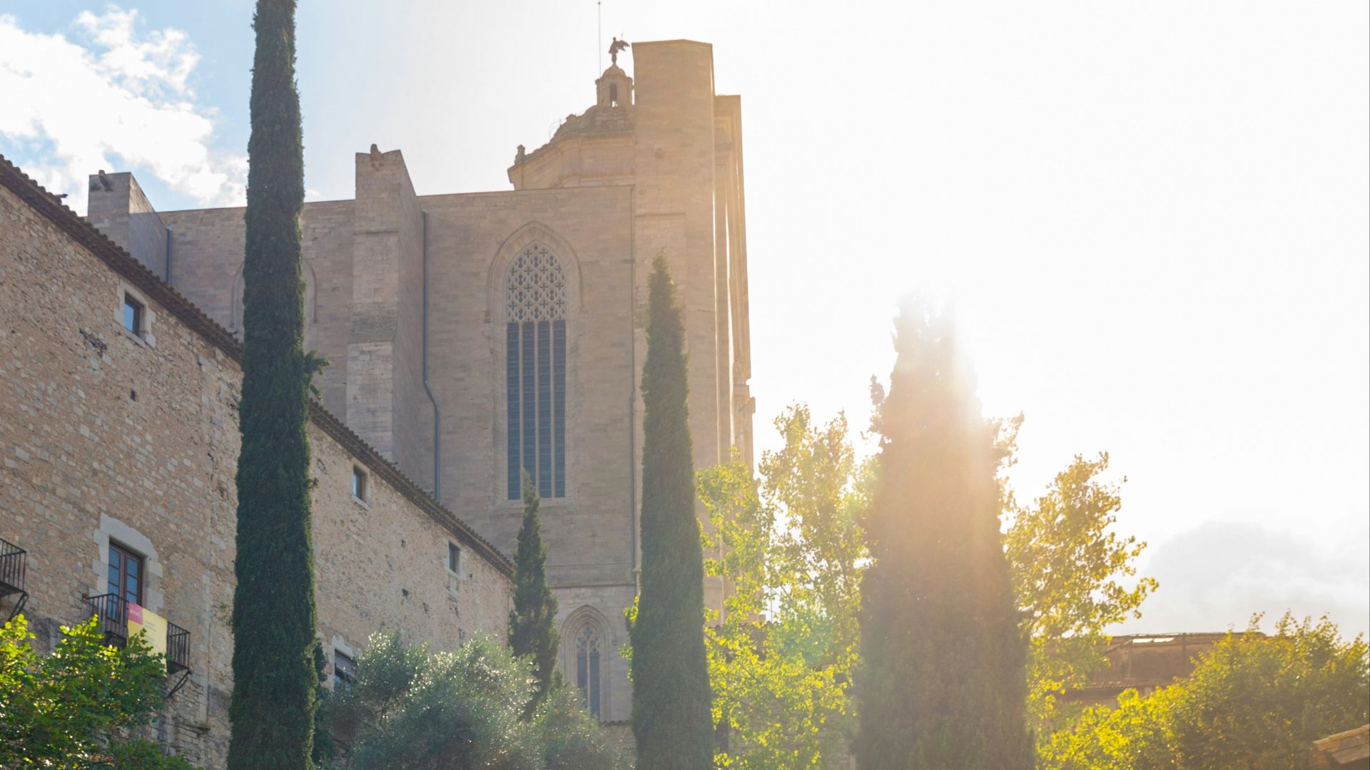 the sun shines on the steps leading to a church
