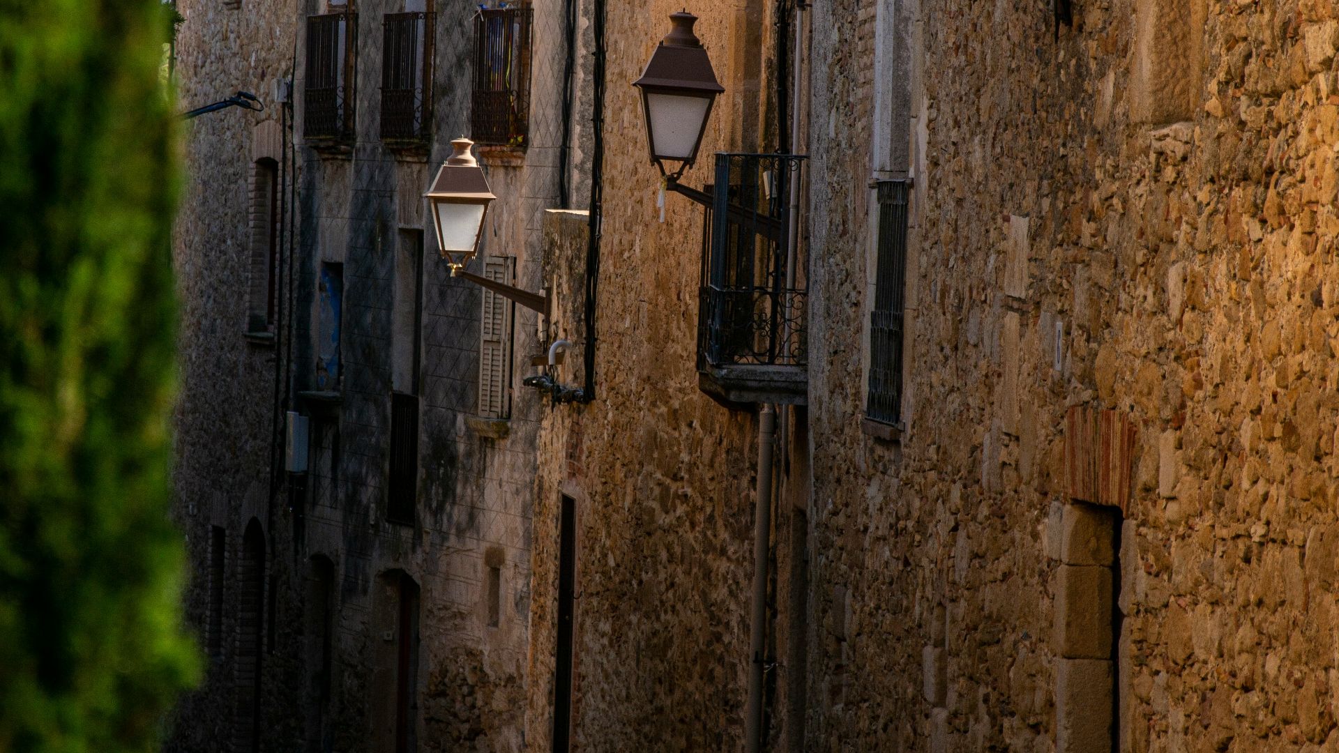 a cobblestone street lined with stone buildings