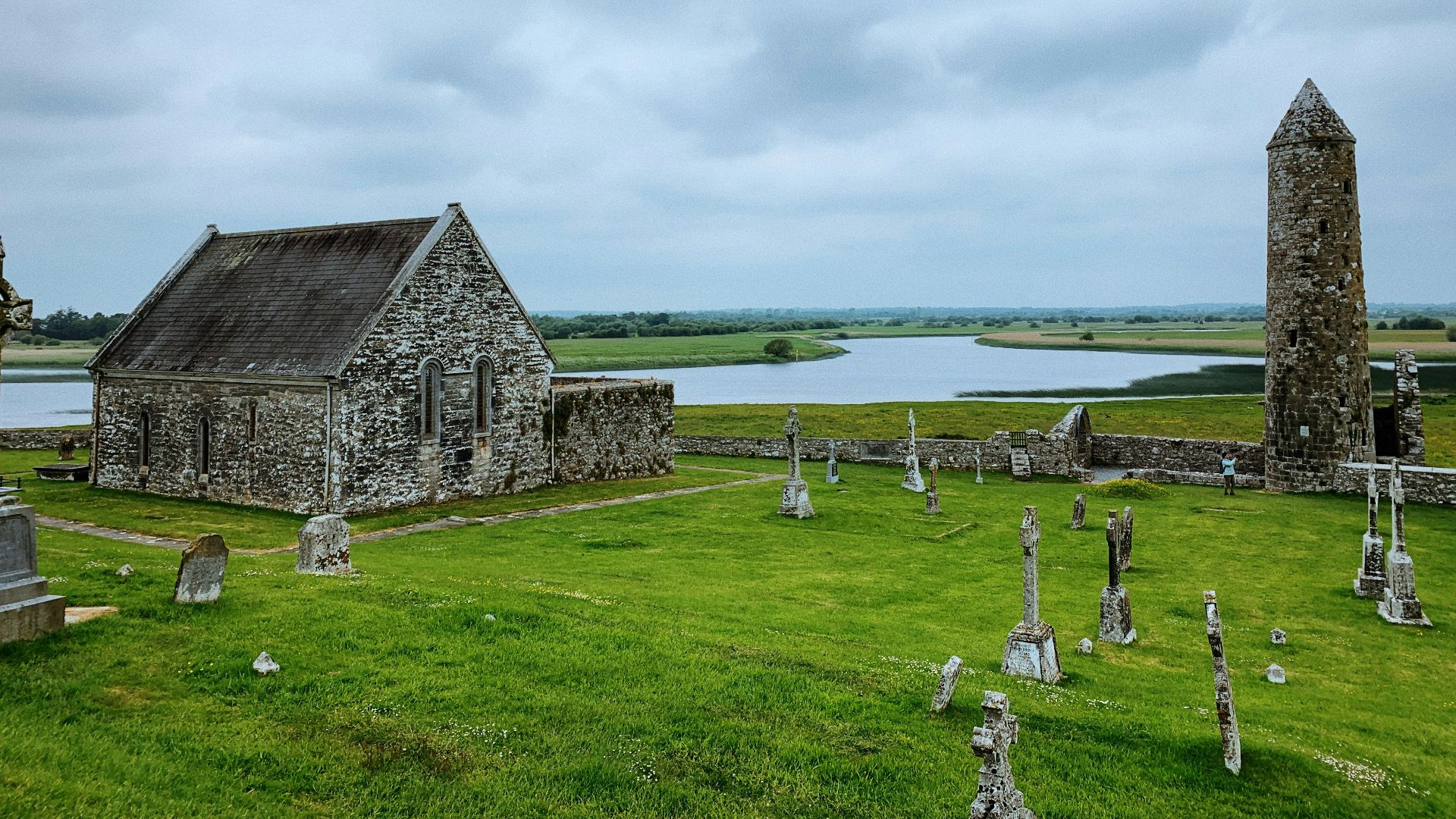 a cemetery with a stone building