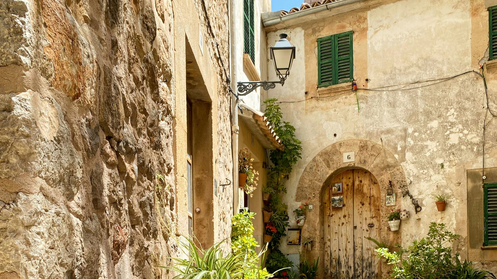 a stone walkway between buildings