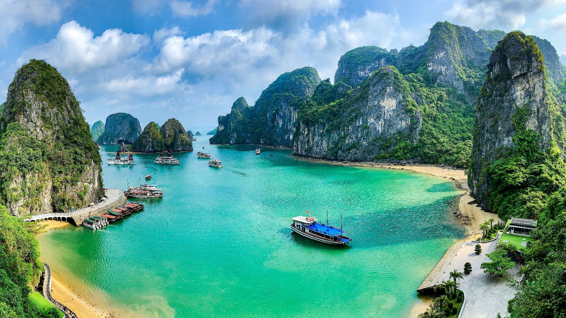 a group of boats floating on top of a body of water
