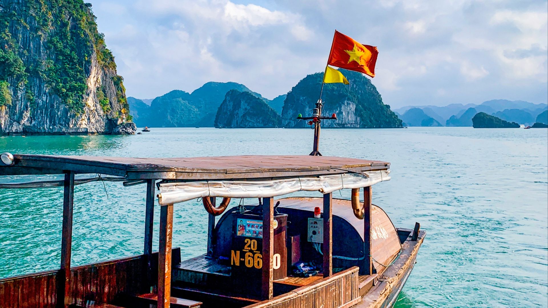 a long boat floating on top of a body of water