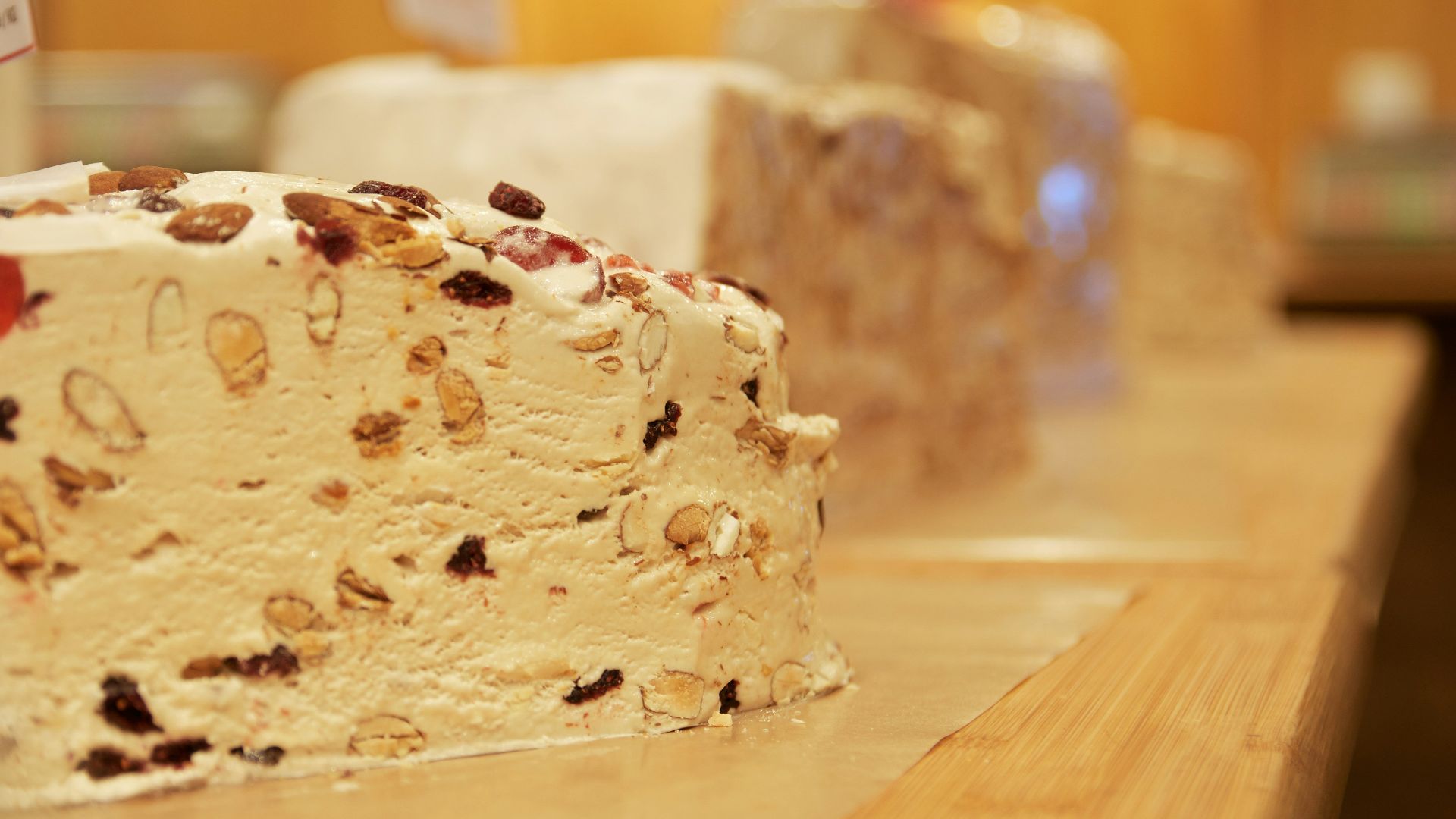 white and brown cake on brown wooden table