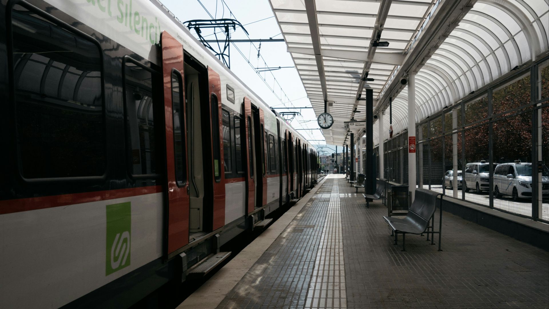 red and white train on train station