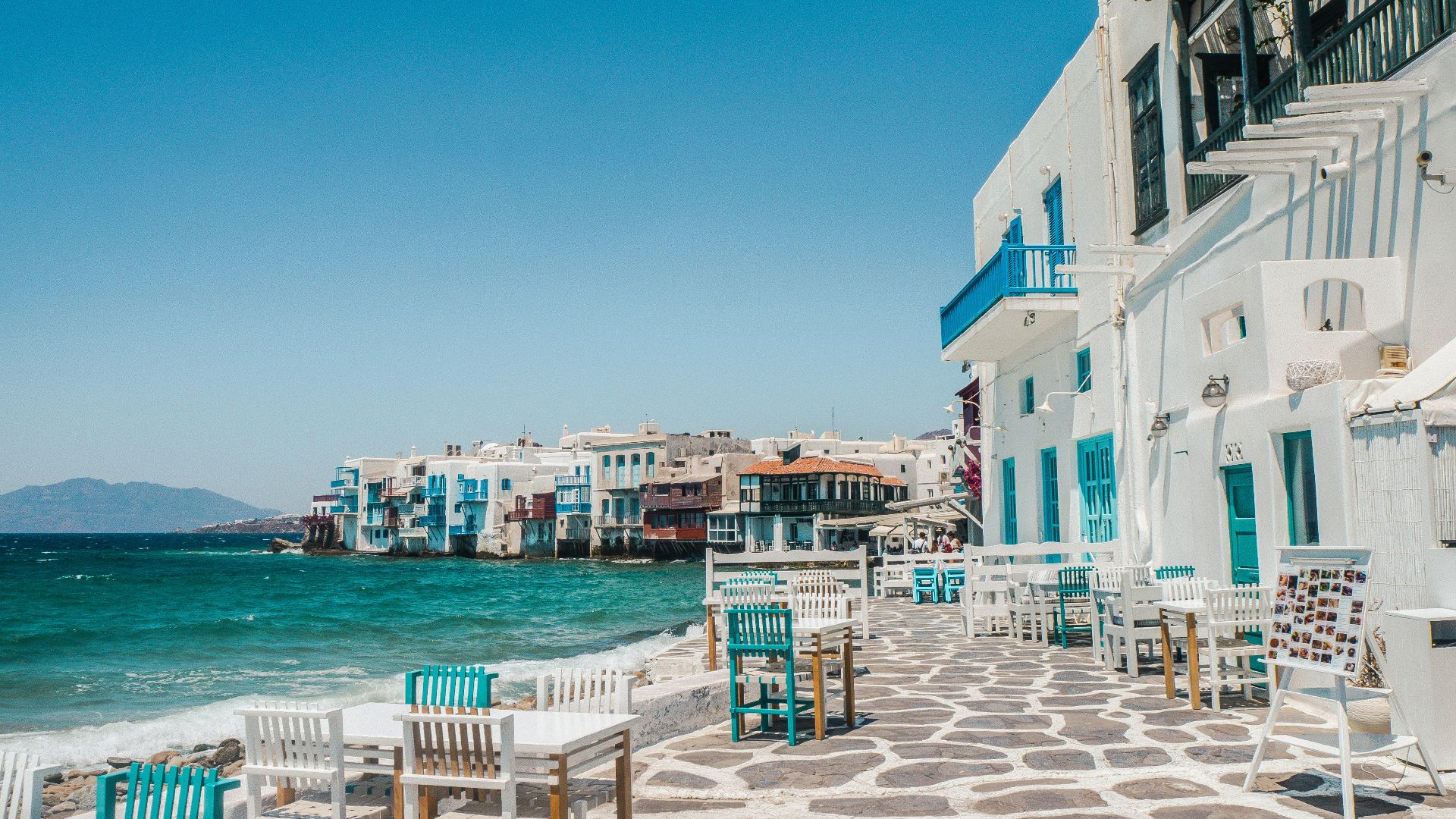 white and brown concrete buildings near sea during daytime