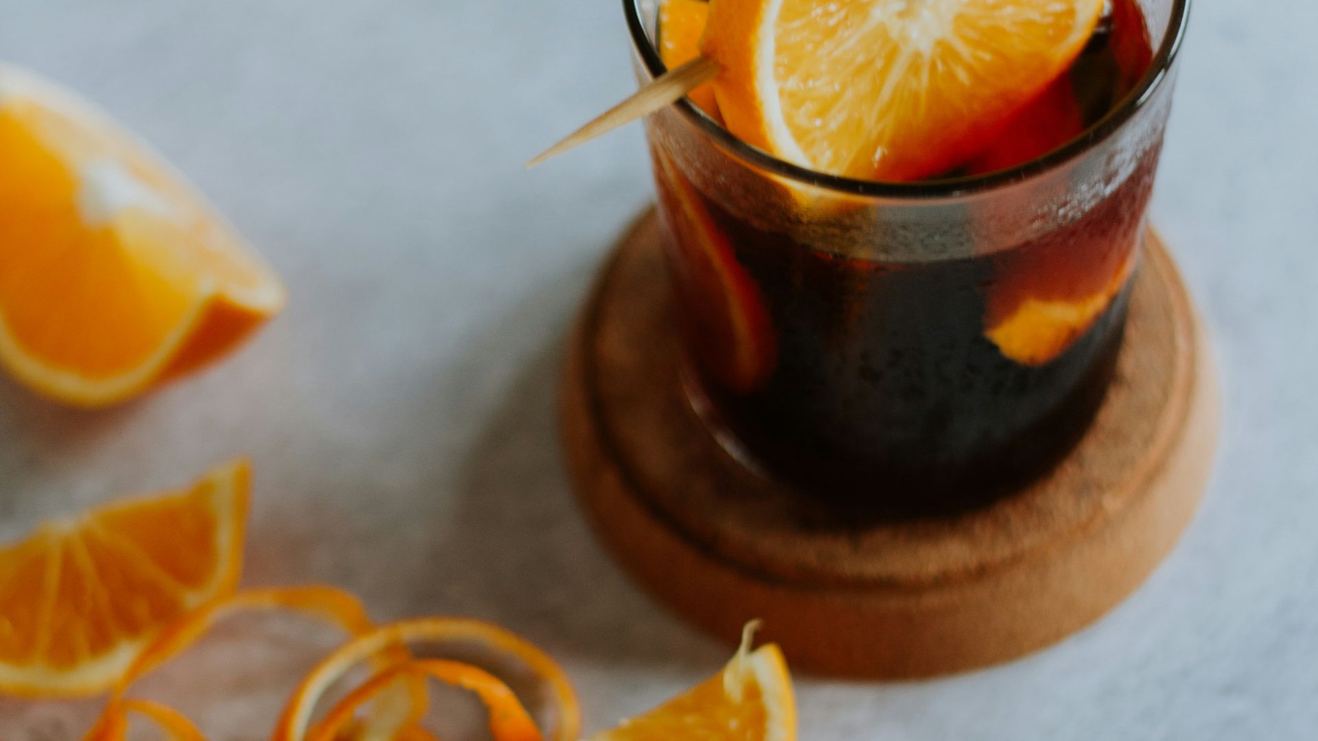 sliced orange fruit on brown wooden round plate