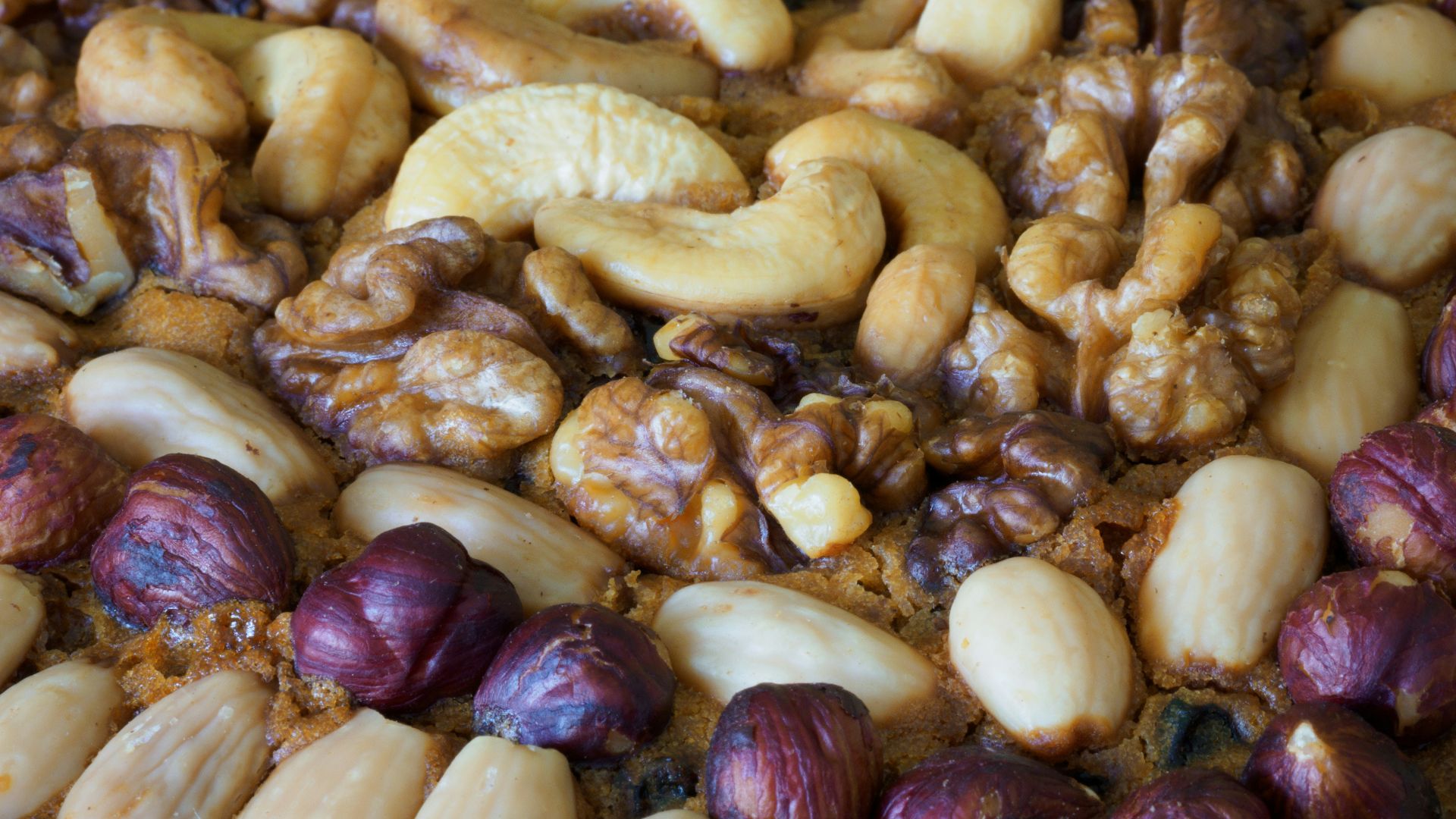 brown and beige nuts on white paper