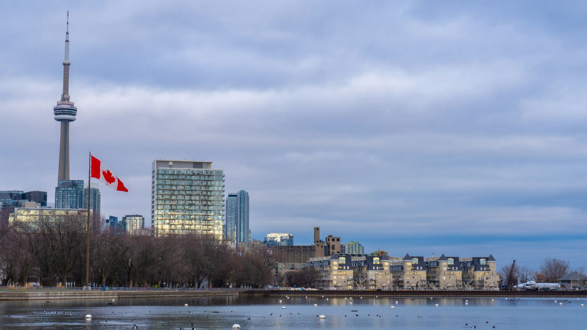 city skyline under cloudy sky during daytime