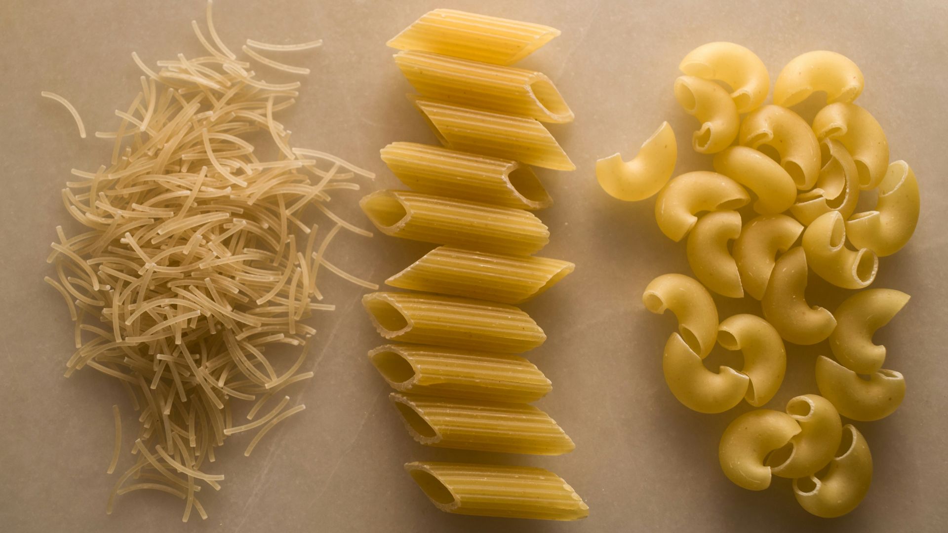 yellow pasta on white table