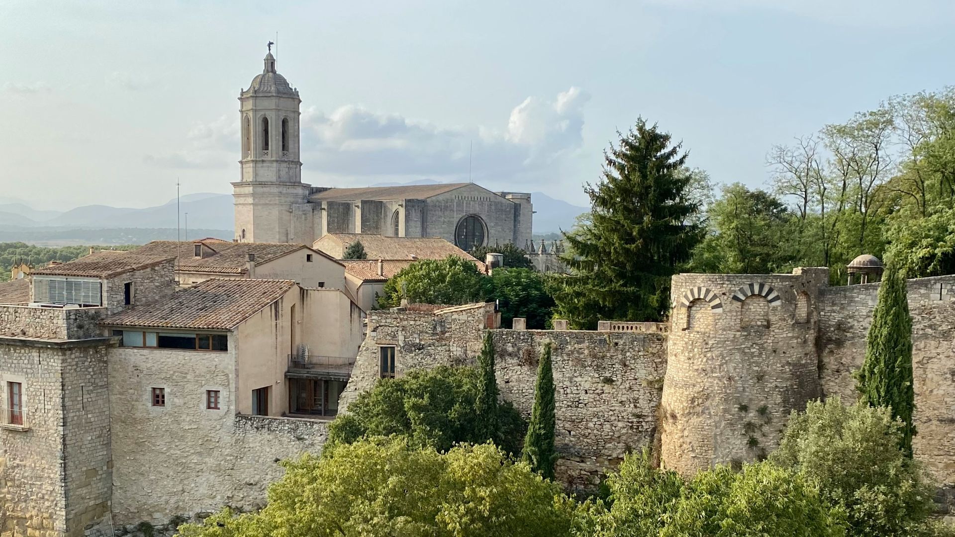 a view of a castle with a clock tower in the background