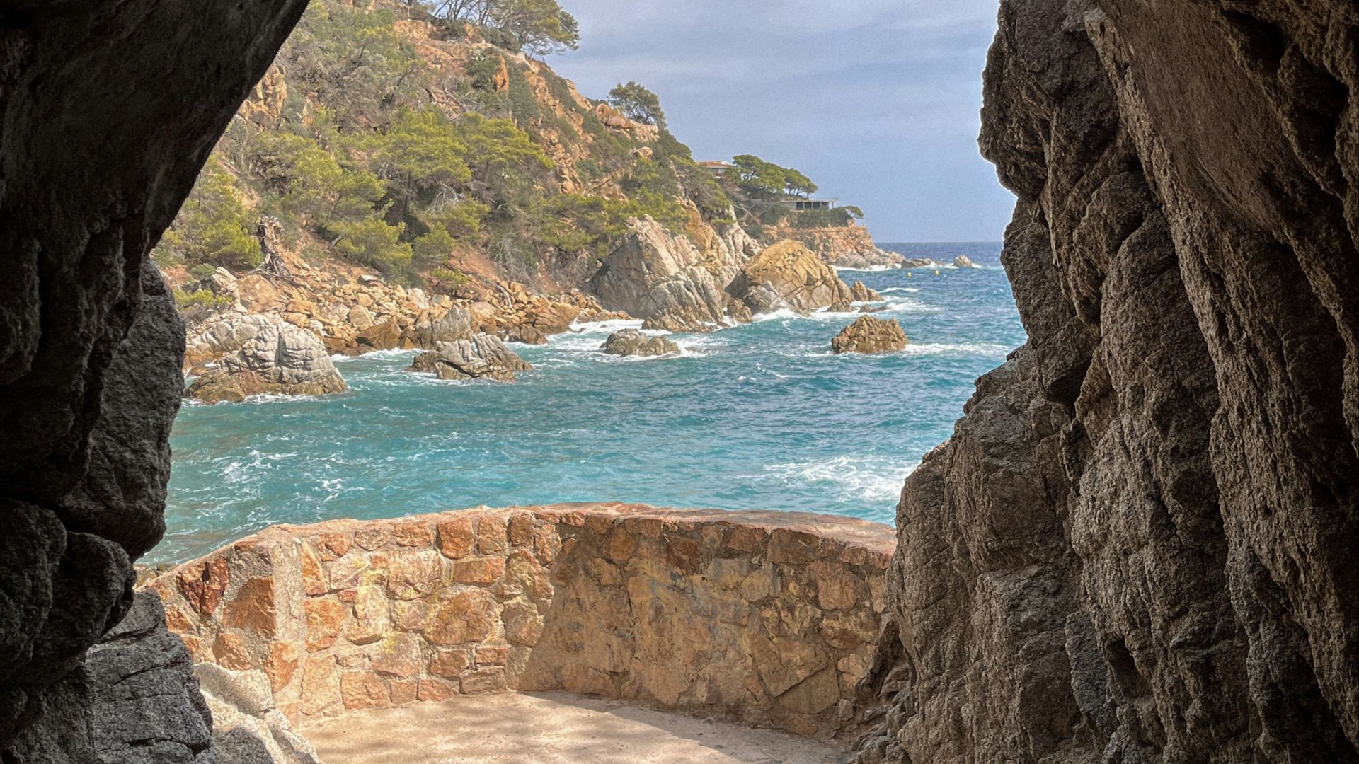 a view of the ocean from inside a cave