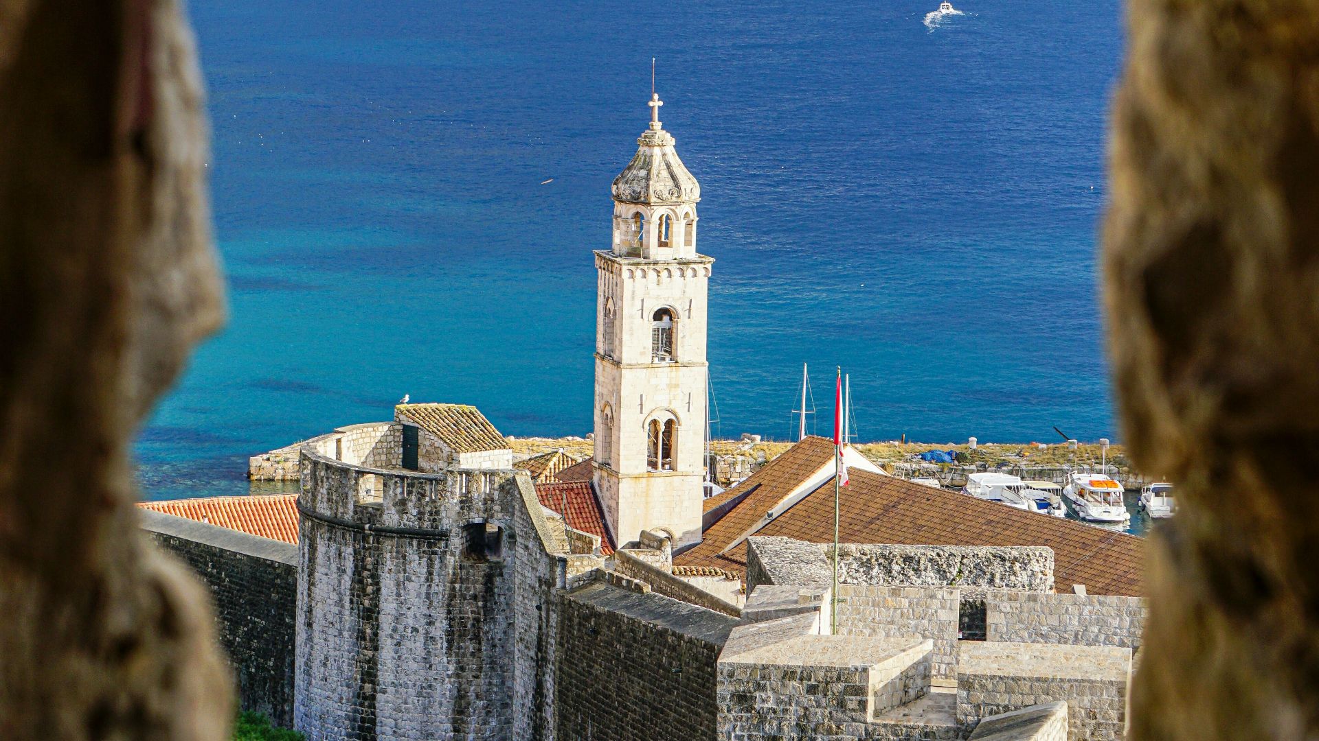 brown concrete building near body of water during daytime