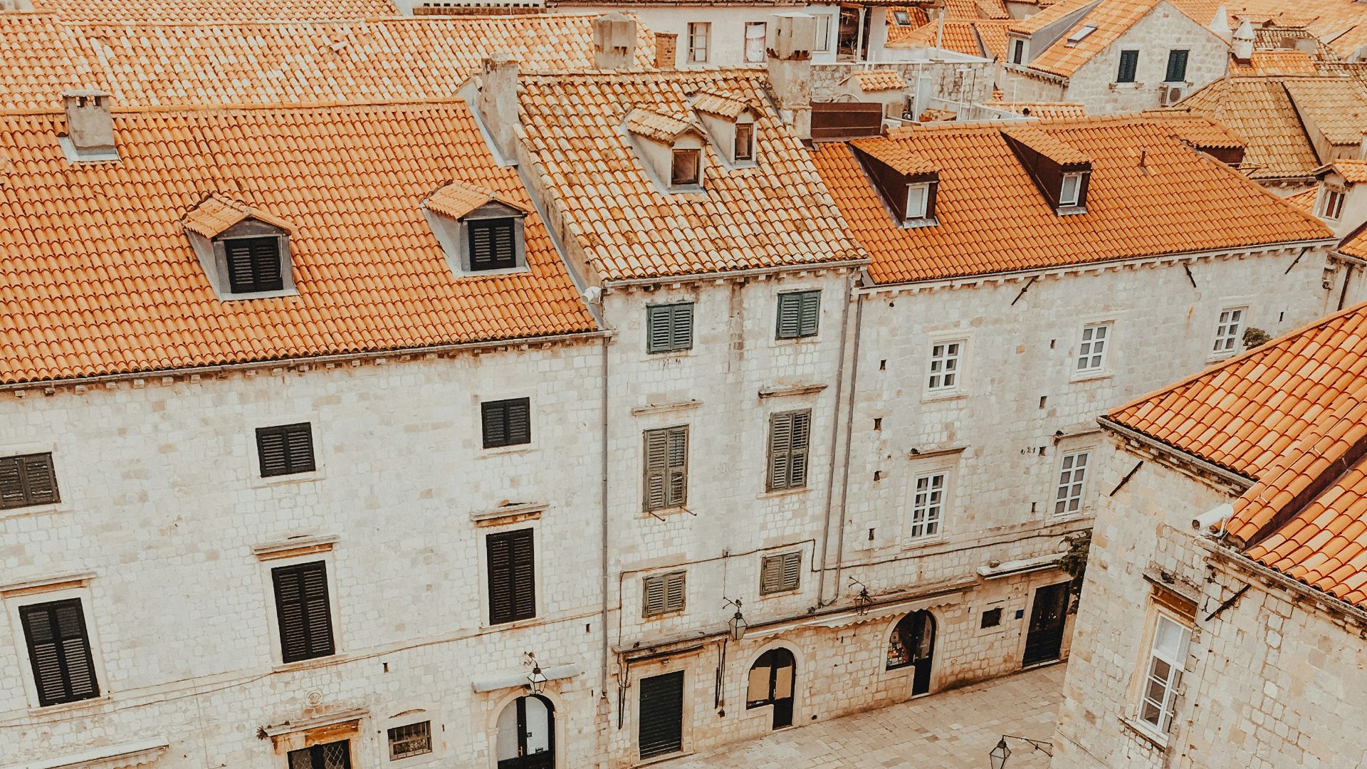 people walking on street near brown concrete building during daytime