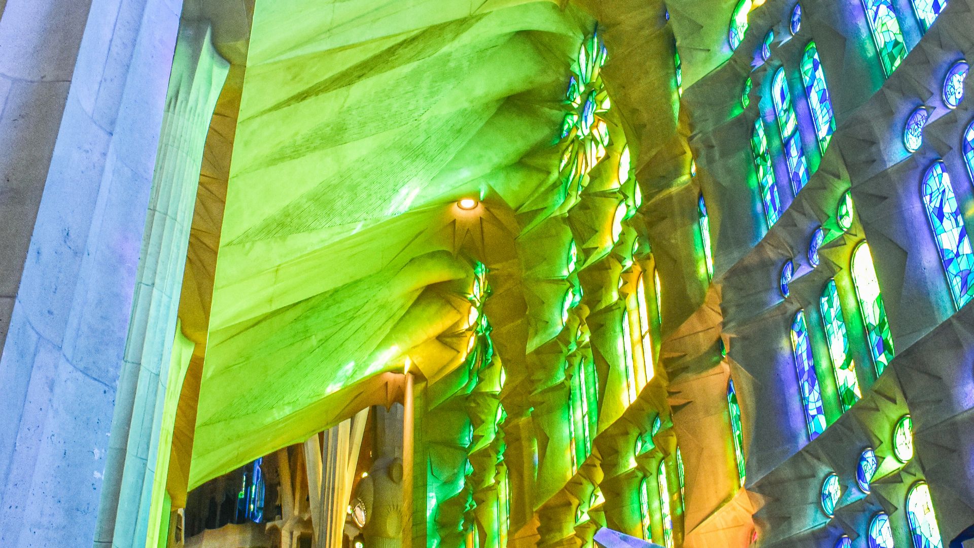 The interior of a large cathedral with stained glass windows