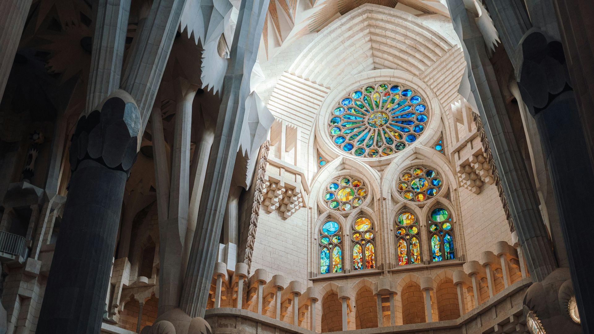 The inside of a cathedral with stained glass windows