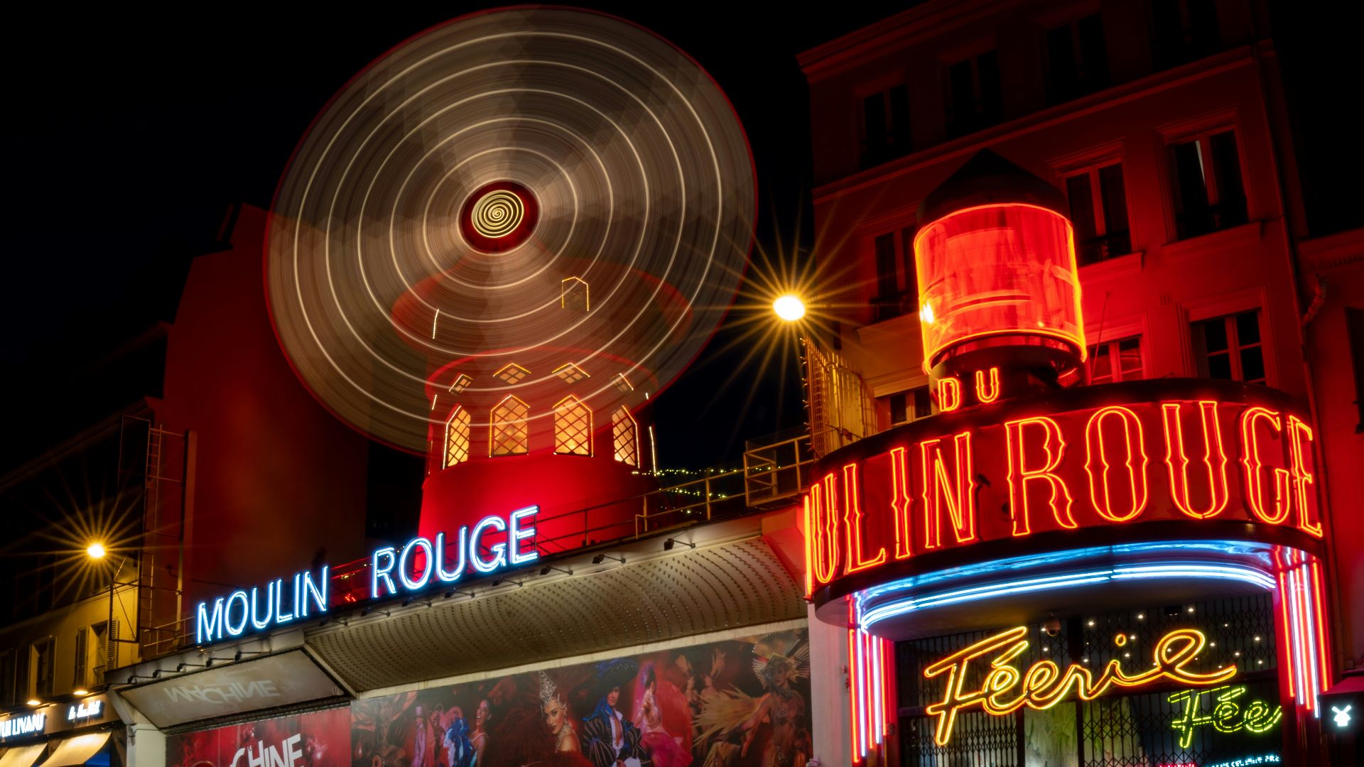 a large ferris wheel sitting on top of a building