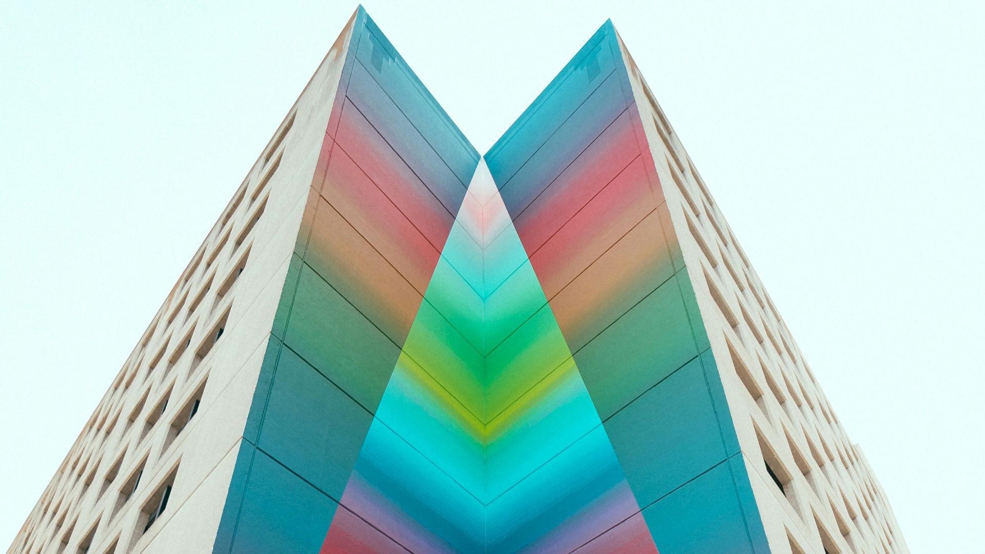 man in black jacket standing on building