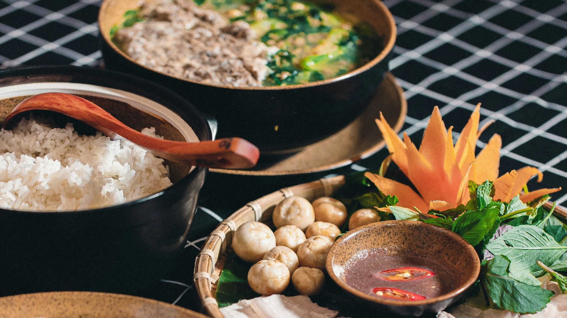 a table topped with lots of different bowls of food