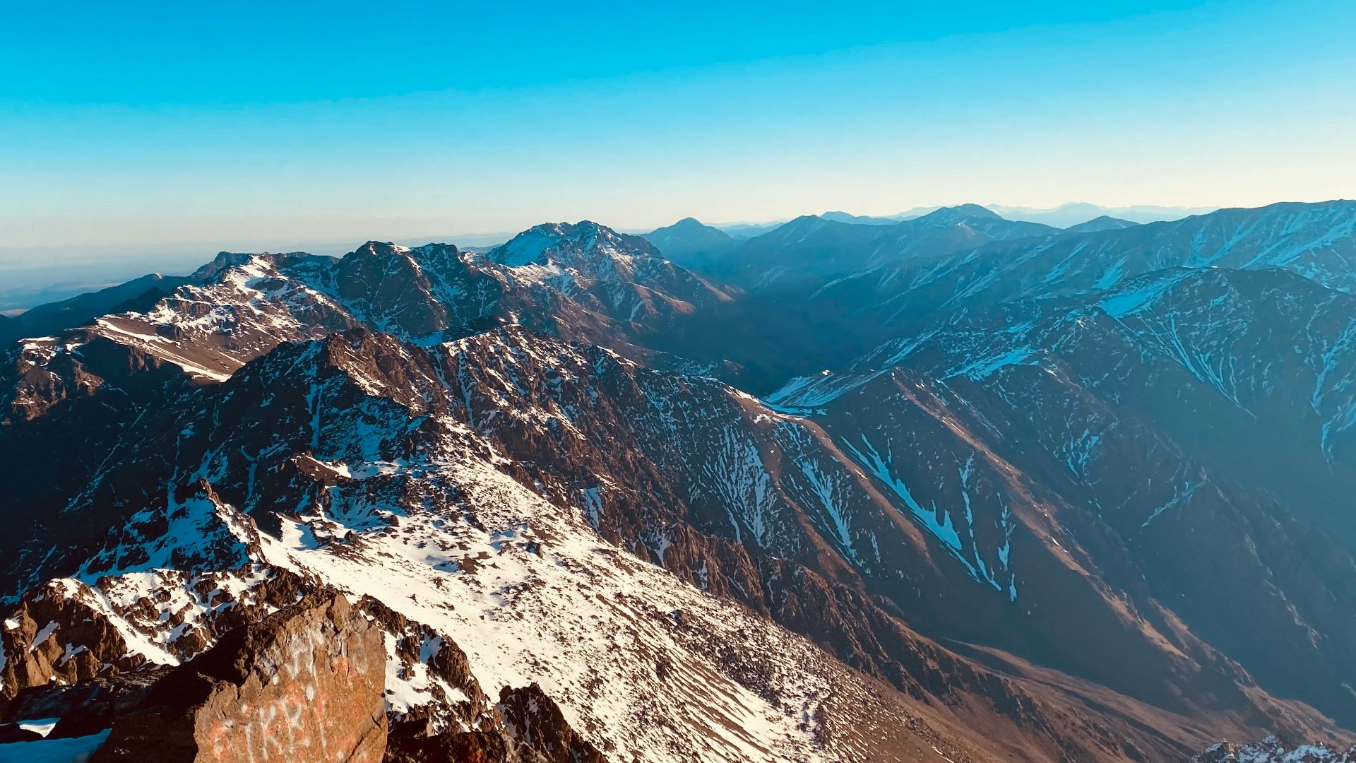snow covered mountain under blue sky during daytime