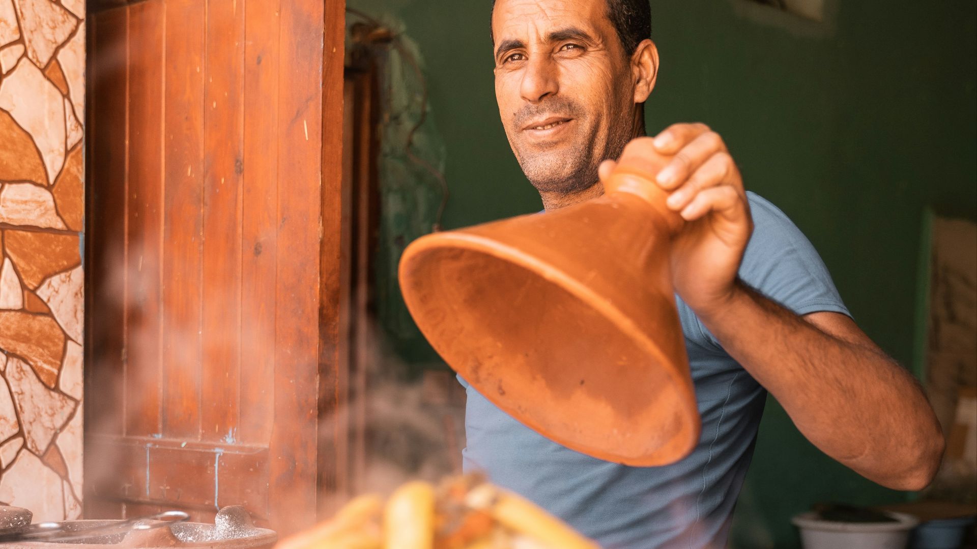a man holding a bowl of food