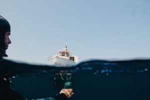 a-yacht-on-sea-and-man-underwater-3098965-300x201.jpg