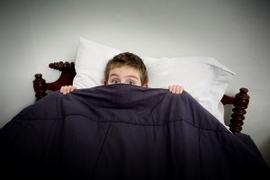 bigstock-boy-hiding-in-bed-under-the-co-40815694-1526939695865-300x200.jpg