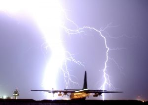 lightning_strike_night_storm_bolt_plane_taxiing_c_130-748208-1551235935657-300x214.jpg