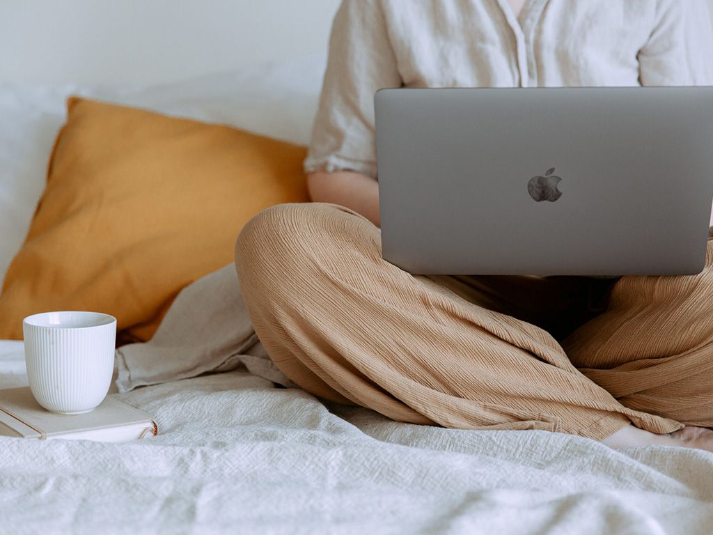 resizeCanva-Anonymous-woman-using-laptop-in-bedroom-scaled-1.jpg.optimal.jpg