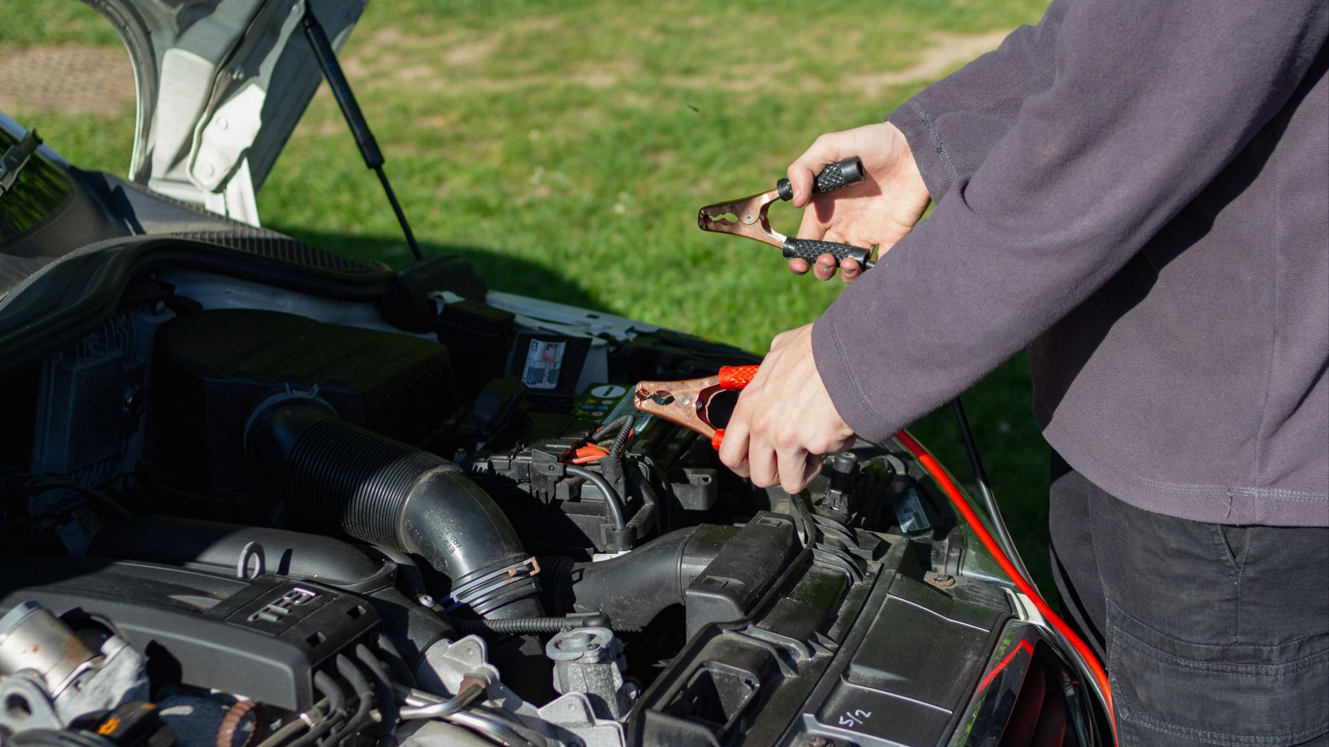 person in gray long sleeve shirt riding black motorcycle