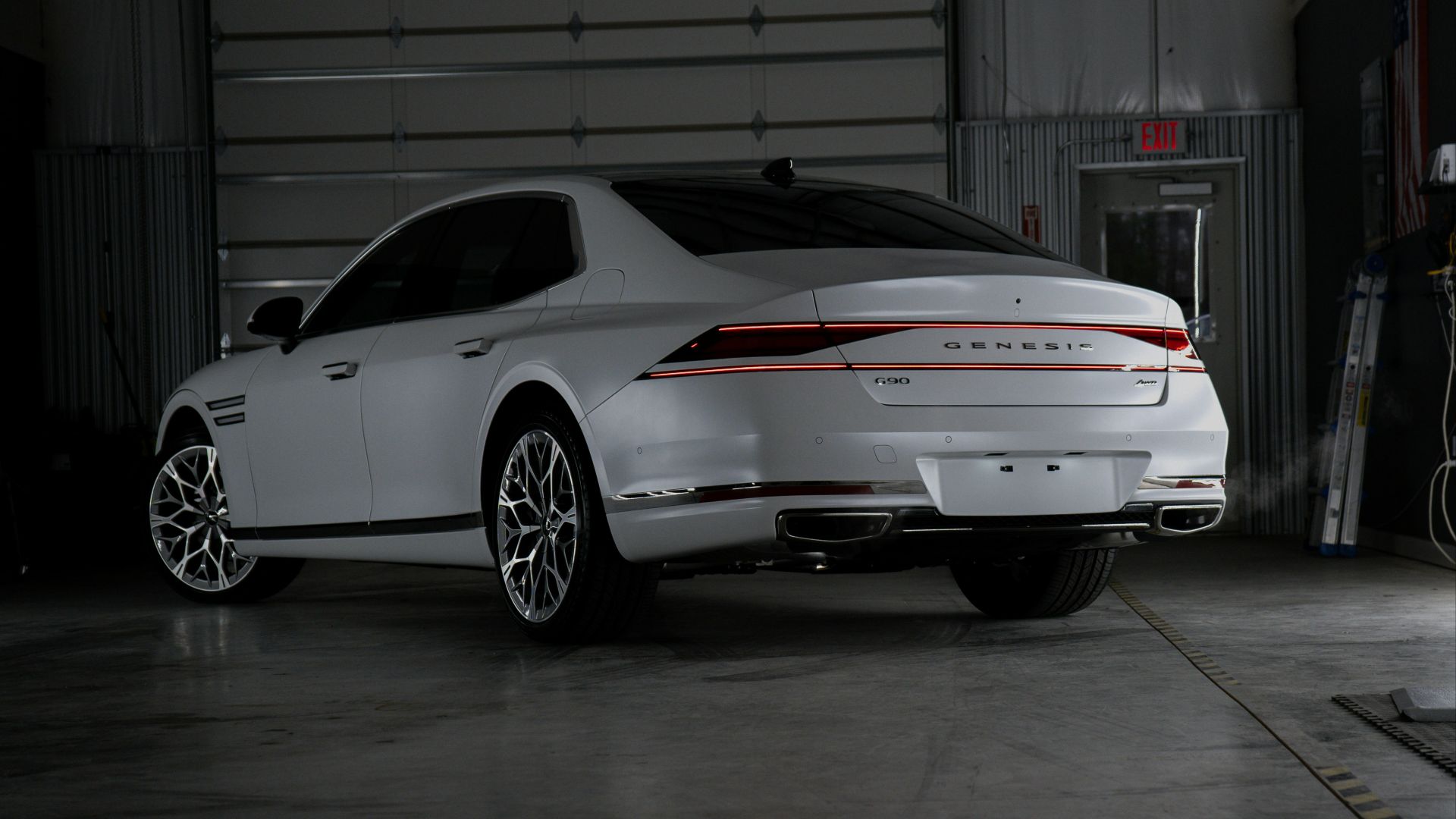 A white car is parked in a garage