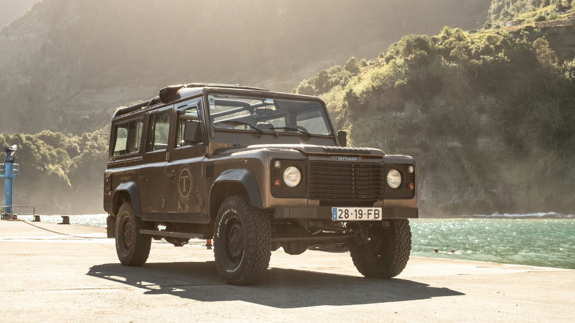 a jeep is parked on the side of the road