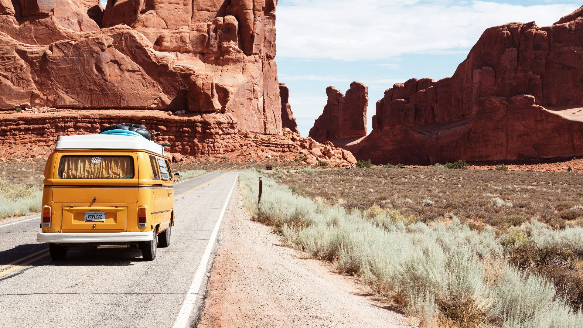 yellow Volkswagen van on road